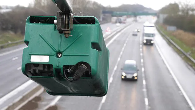 anpr camera o bridge over looking motorway with cars
