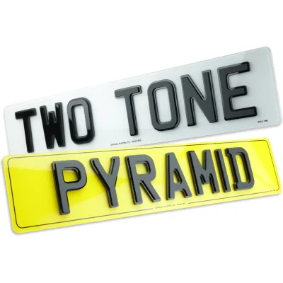 Two-tone pyramid 4D number plates with layered raised letters.