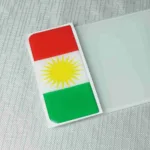 Kurdistan flag number plate badge with sun emblem.